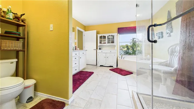 a spacious bathroom with a double vanity sink and a mirror