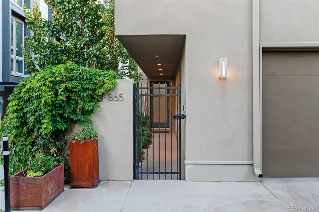 a view of a street with a garage