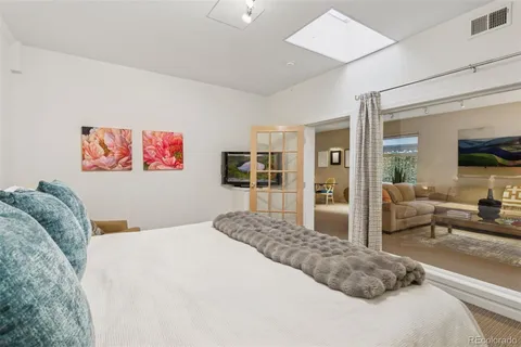 a bedroom with two beds and a window