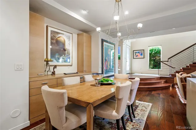 a kitchen with kitchen island a stove a table and chairs