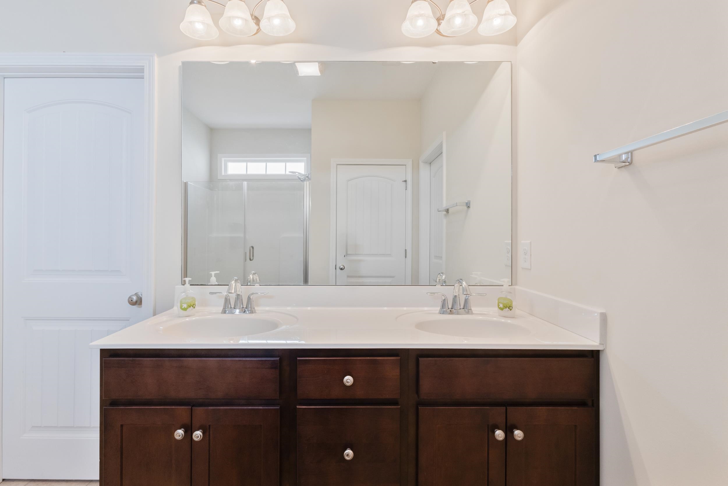 224 Obi Lane Surfside Beach, SC 29575 - Photo 16 of 24 Bathroom with shower / tub combo, vanity, and light tile patterned flooring