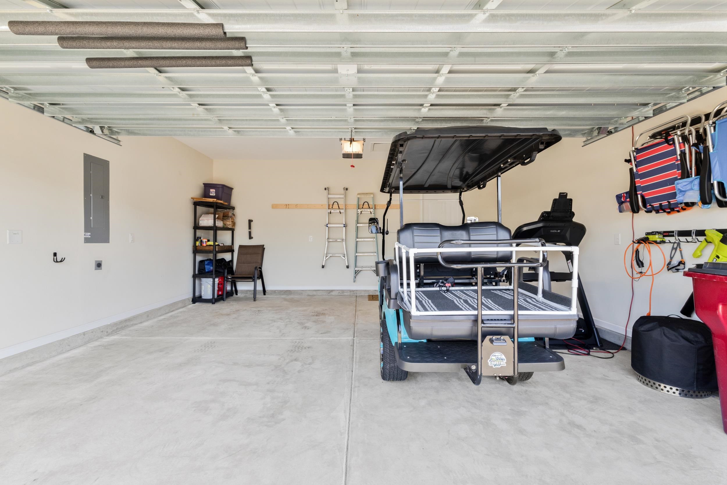 224 Obi Lane Surfside Beach, SC 29575 - Photo 19 of 24 Bedroom with a tray ceiling, ceiling fan, and dark wood-style flooring