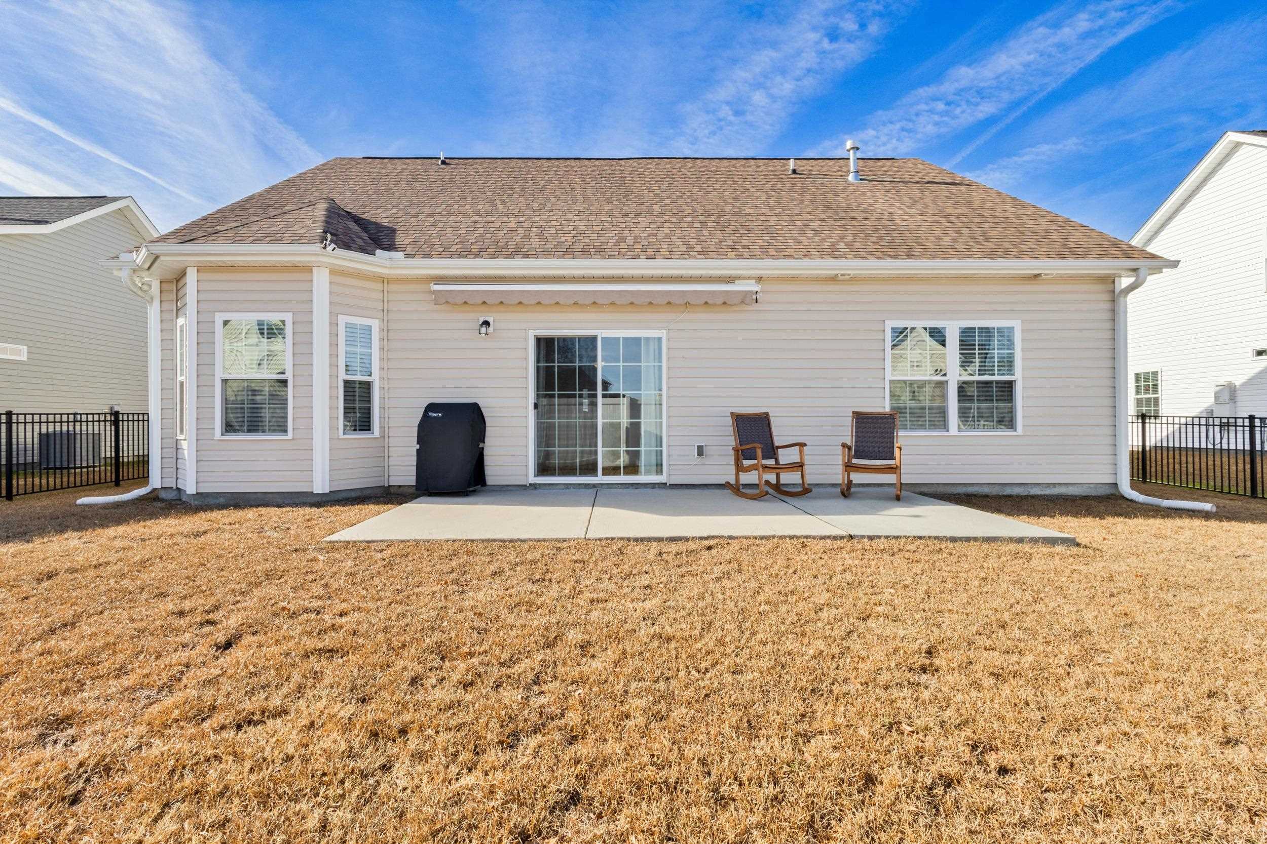 224 Obi Lane Surfside Beach, SC 29575 - Photo 20 of 24 Bedroom featuring dark wood finished floors, ceiling fan, and a raised ceiling