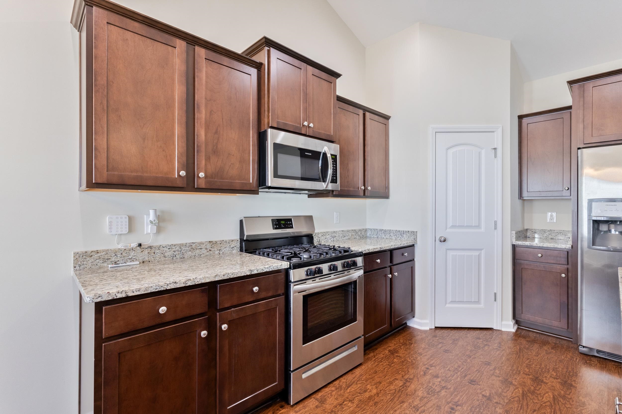 224 Obi Lane Surfside Beach, SC 29575 - Photo 7 of 24 Living room with a chandelier, a ceiling fan, dark wood-style floors, and high vaulted ceiling