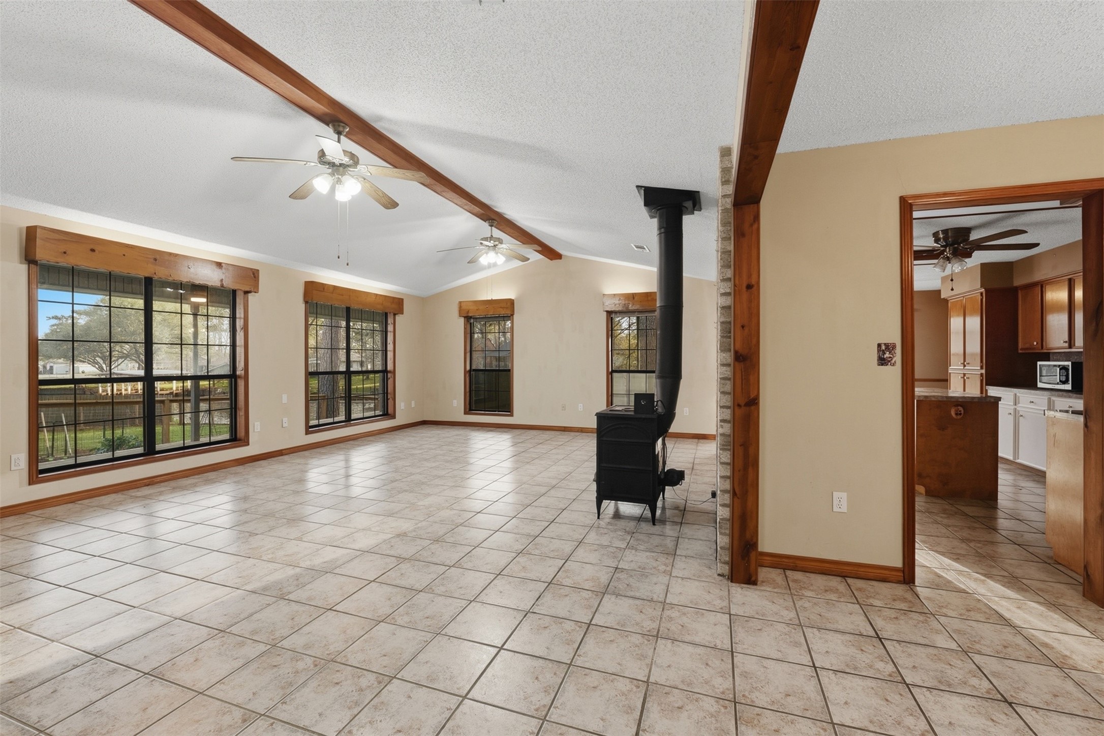 200 Cove View Drive Trinity, TX 75862 - Photo 12 of 39 a view of empty room with wooden floor and floor to ceiling window