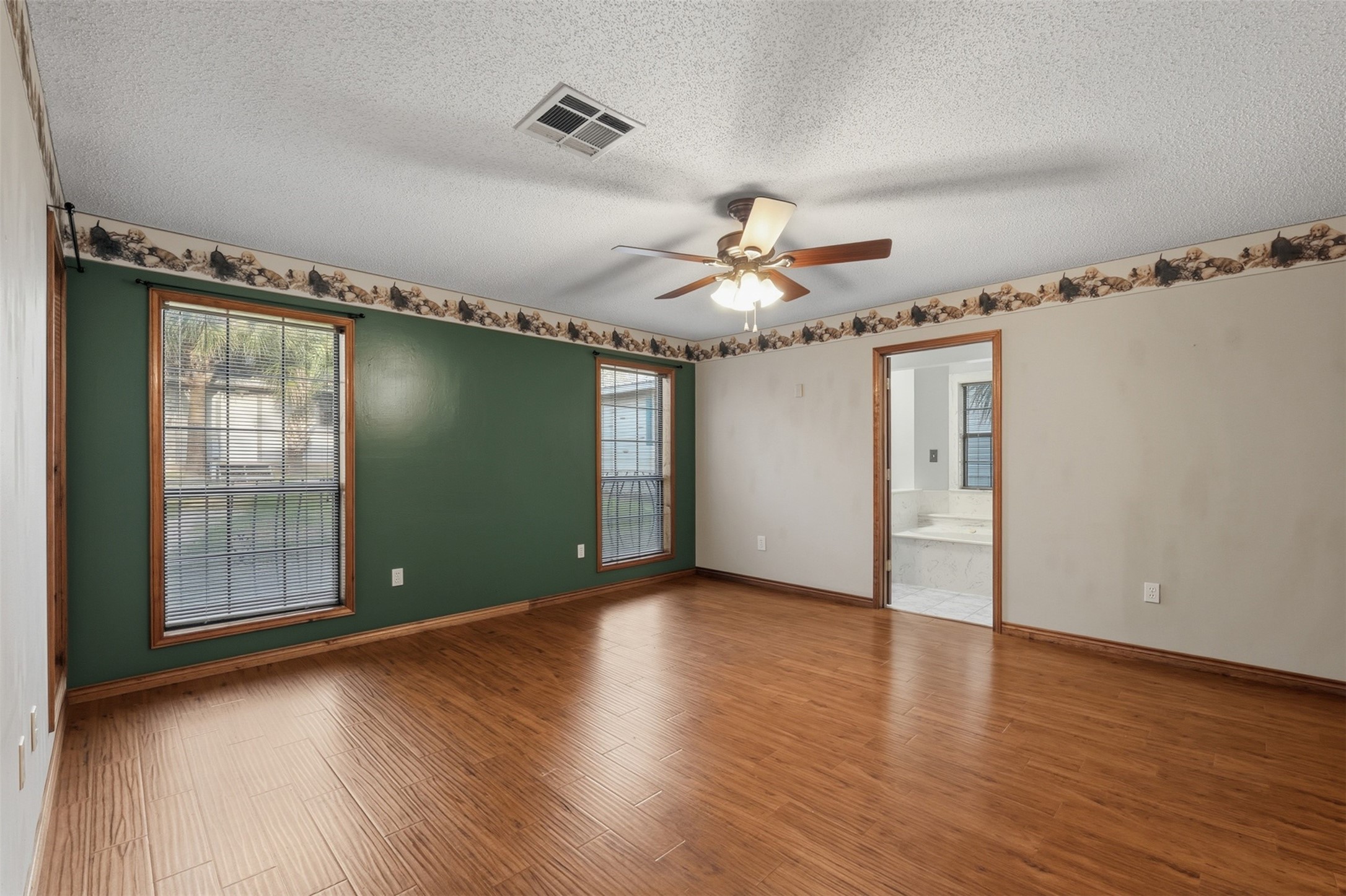 200 Cove View Drive Trinity, TX 75862 - Photo 14 of 39 a view of an empty room with a window and wooden floor