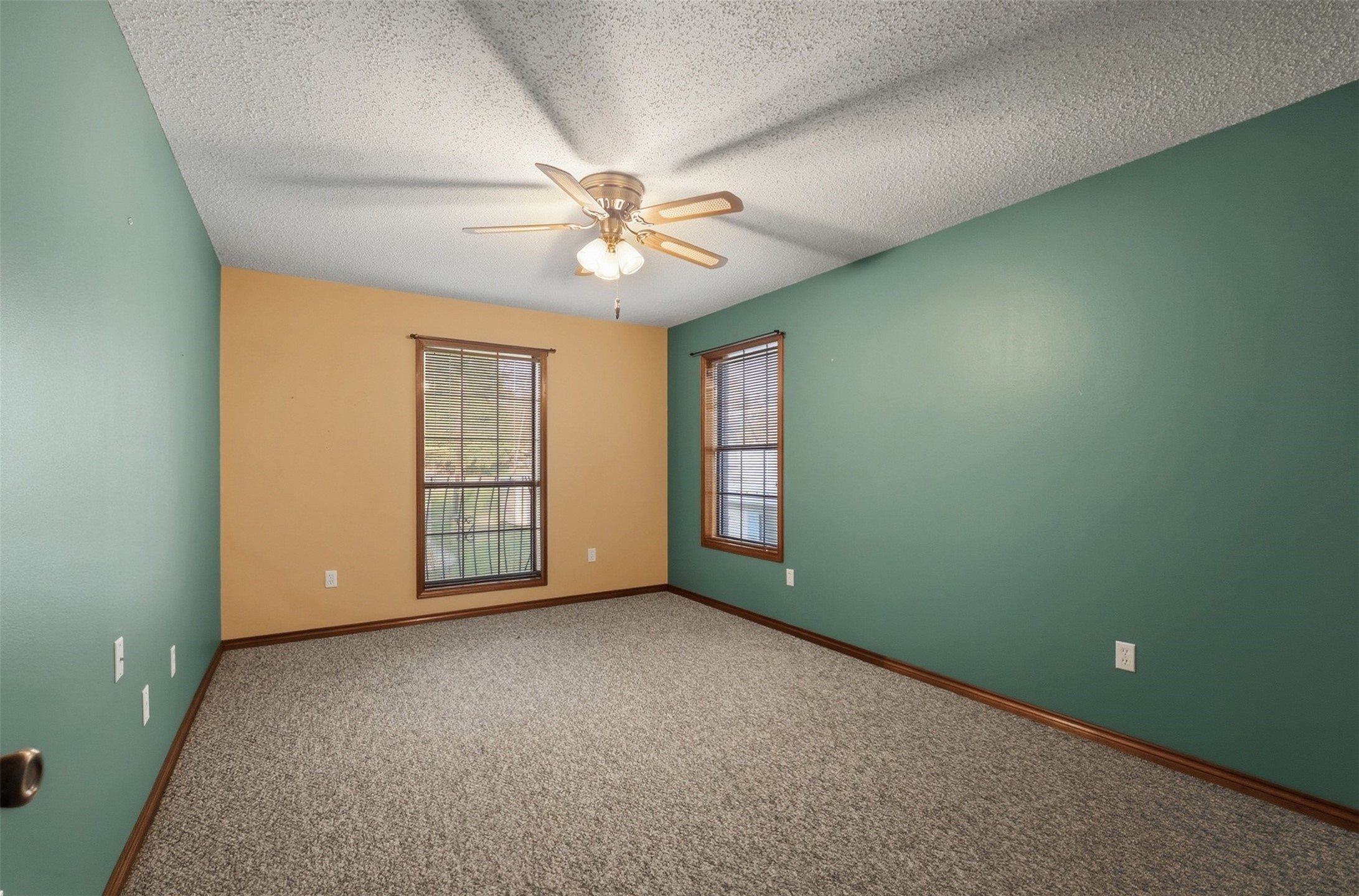 200 Cove View Drive Trinity, TX 75862 - Photo 15 of 39 an empty room with windows and fan