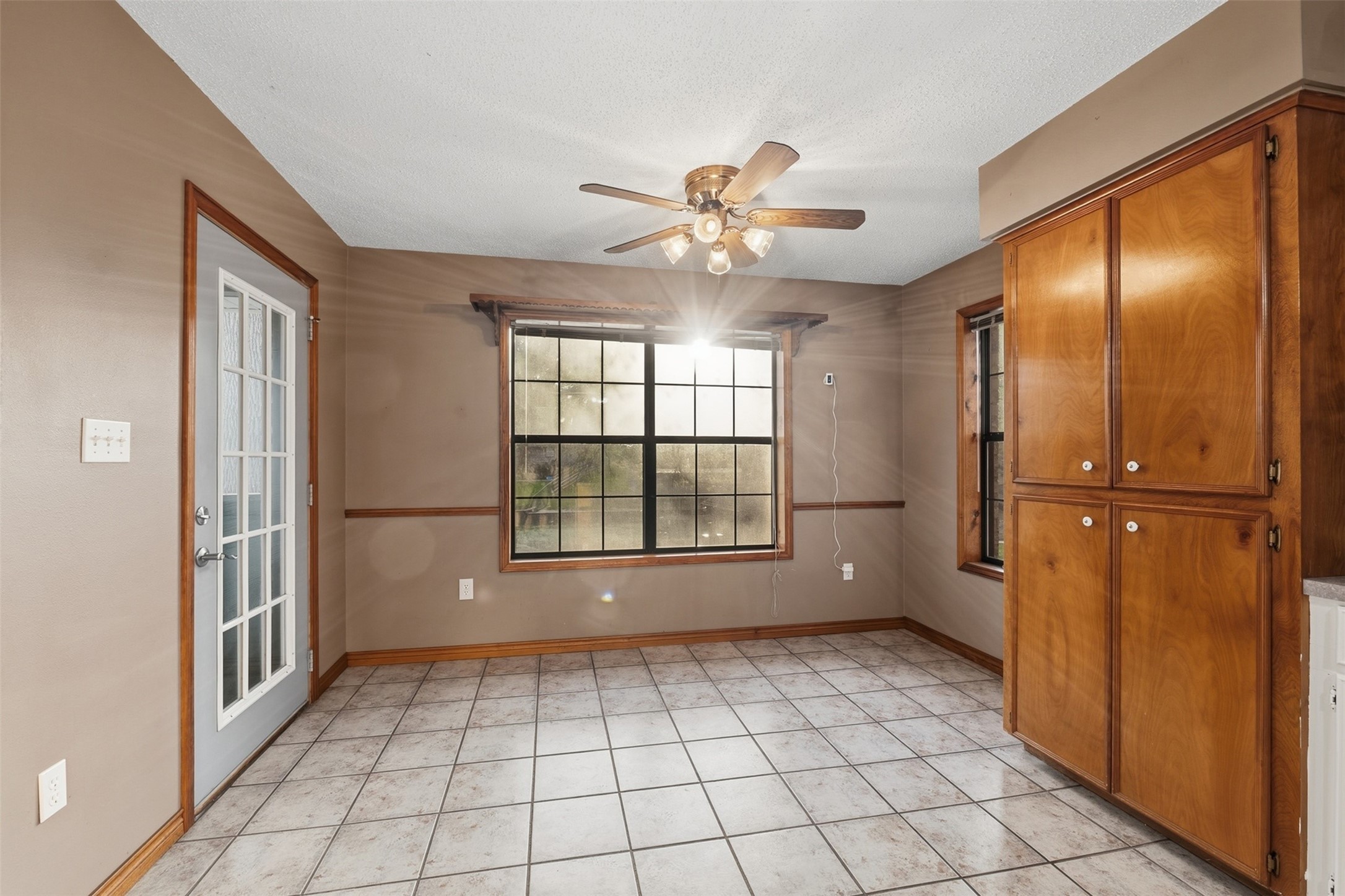 200 Cove View Drive Trinity, TX 75862 - Photo 8 of 39 a view of an empty room with window and chandelier fan