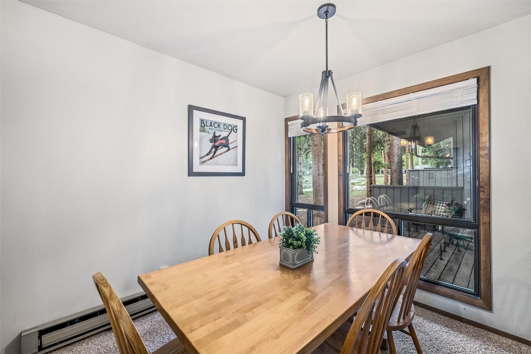 100 Wild Irishman Road, Unit 1103 Keystone, CO 80435 - Photo 12 of 33 Carpeted dining area with a notable chandelier and baseboard heating