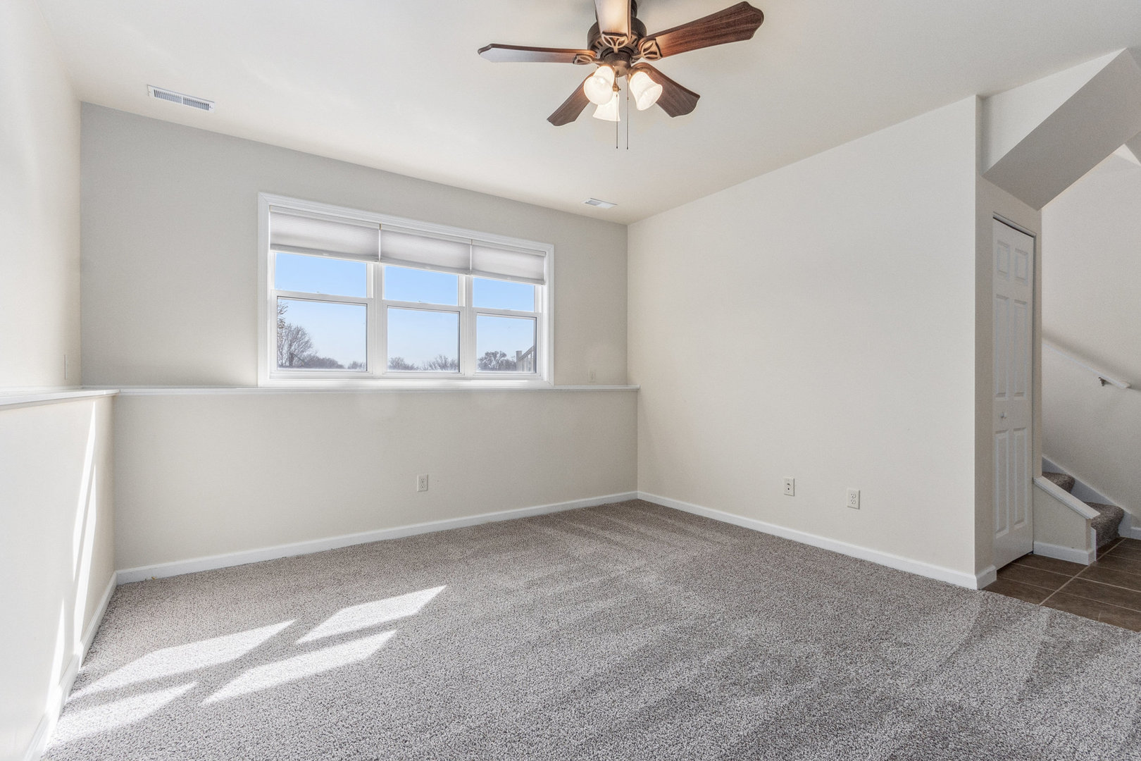 415 Davidson Drive Minooka, IL 60447 - Photo 11 of 18 a view of an empty room with a window