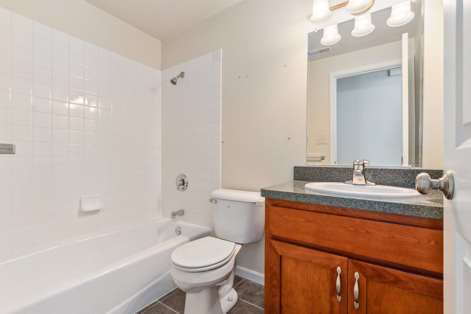 415 Davidson Drive Minooka, IL 60447 - Photo 13 of 18 a bathroom with a sink a toilet and shower