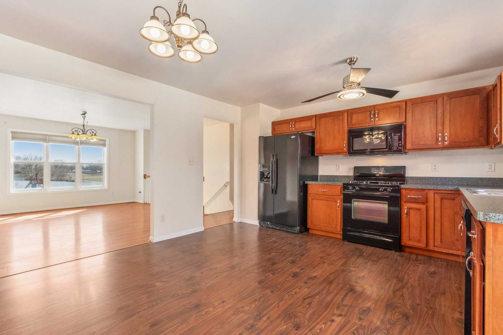 415 Davidson Drive Minooka, IL 60447 - Photo 6 of 18 a kitchen with stainless steel appliances granite countertop a refrigerator a stove top oven a sink and dishwasher