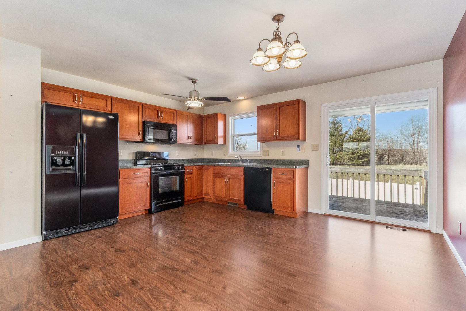 415 Davidson Drive Minooka, IL 60447 - Photo 7 of 18 a kitchen with stainless steel appliances granite countertop a refrigerator a stove top oven a sink and dishwasher