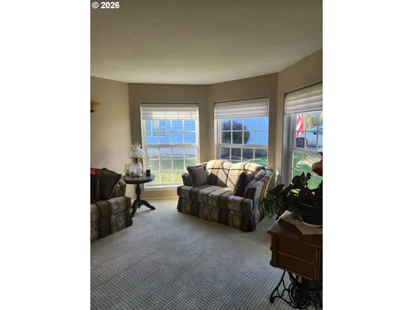 a living room with furniture and windows