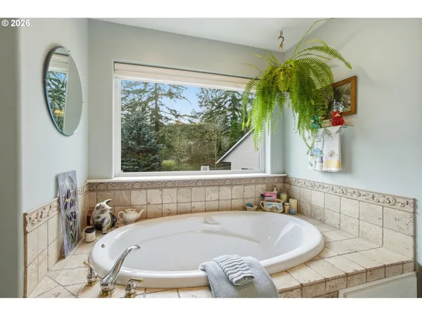 a bath tub sitting next to a window