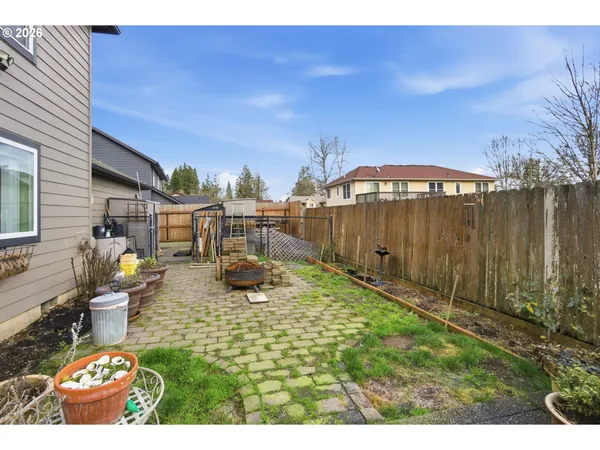 a view of a backyard with sitting area
