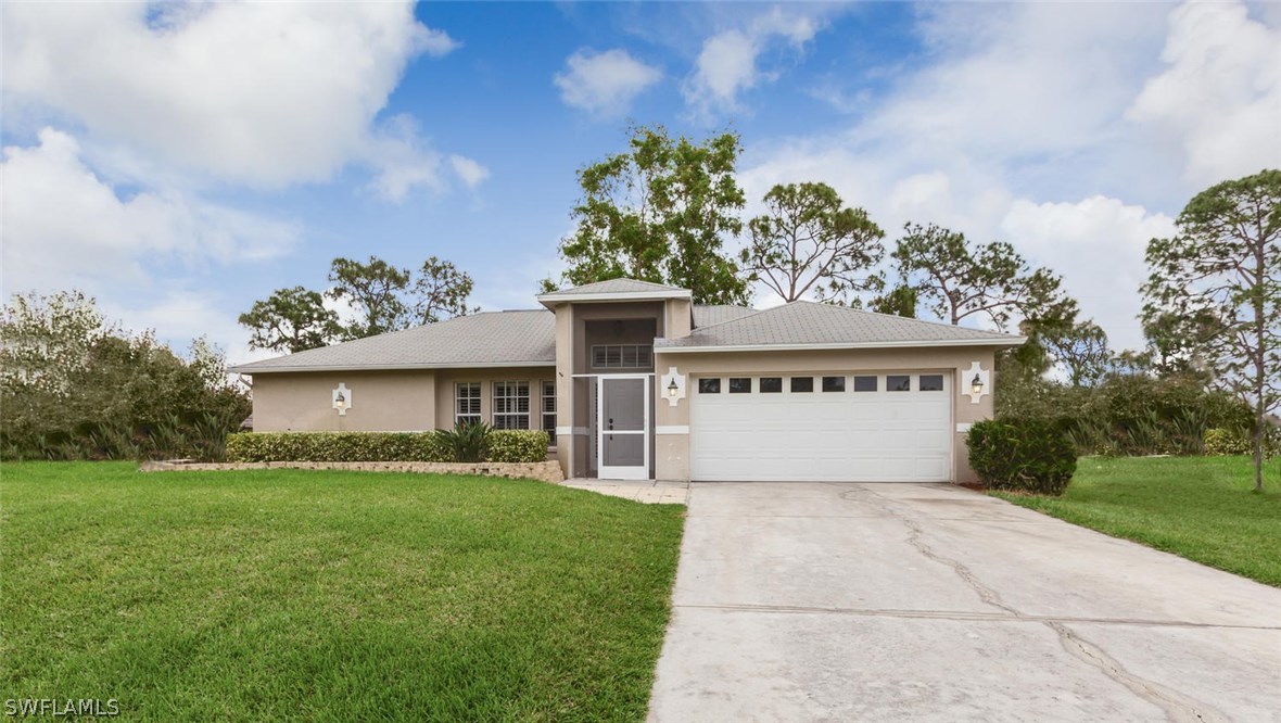 17373 Butler Road Fort Myers, FL 33967 - Photo 2 of 20 a view of a house with a yard