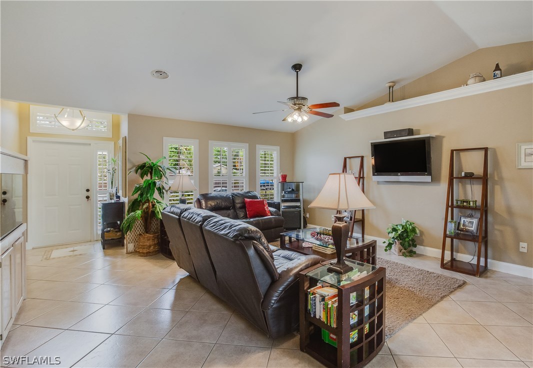 17373 Butler Road Fort Myers, FL 33967 - Photo 3 of 20 a living room with furniture and a flat screen tv