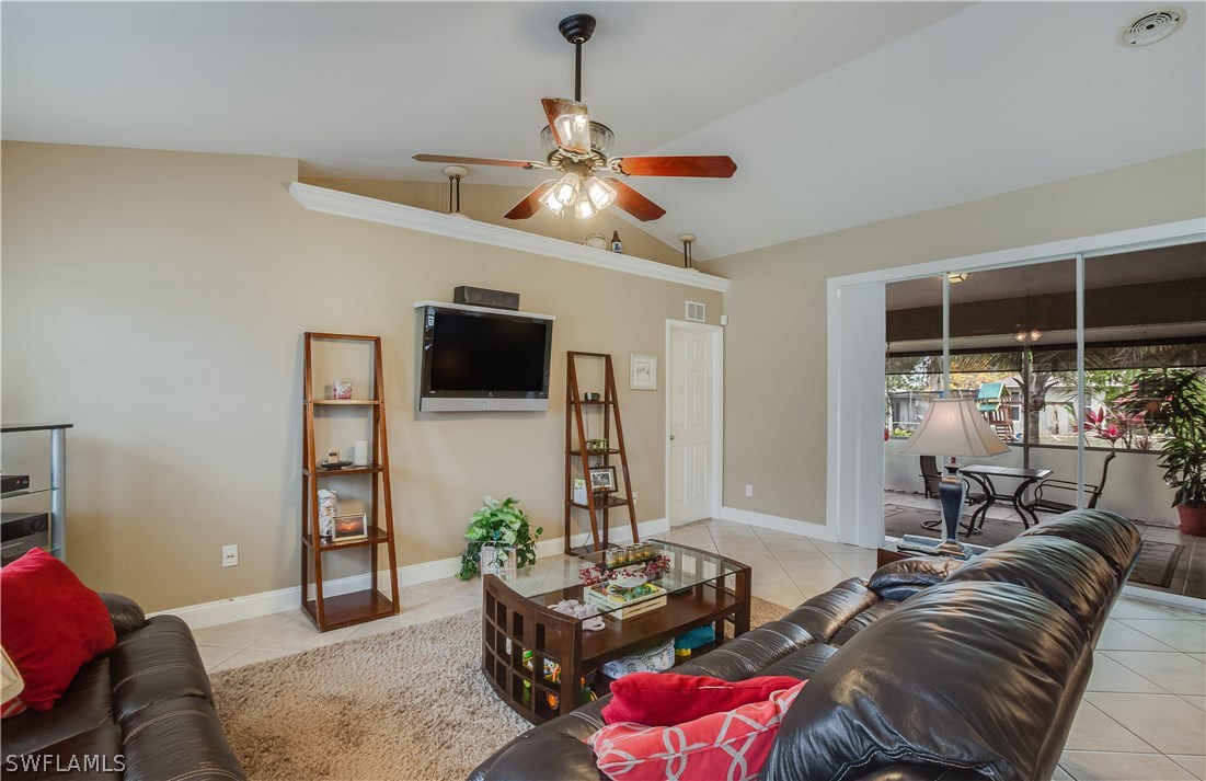 17373 Butler Road Fort Myers, FL 33967 - Photo 4 of 20 a living room with furniture and a flat screen tv