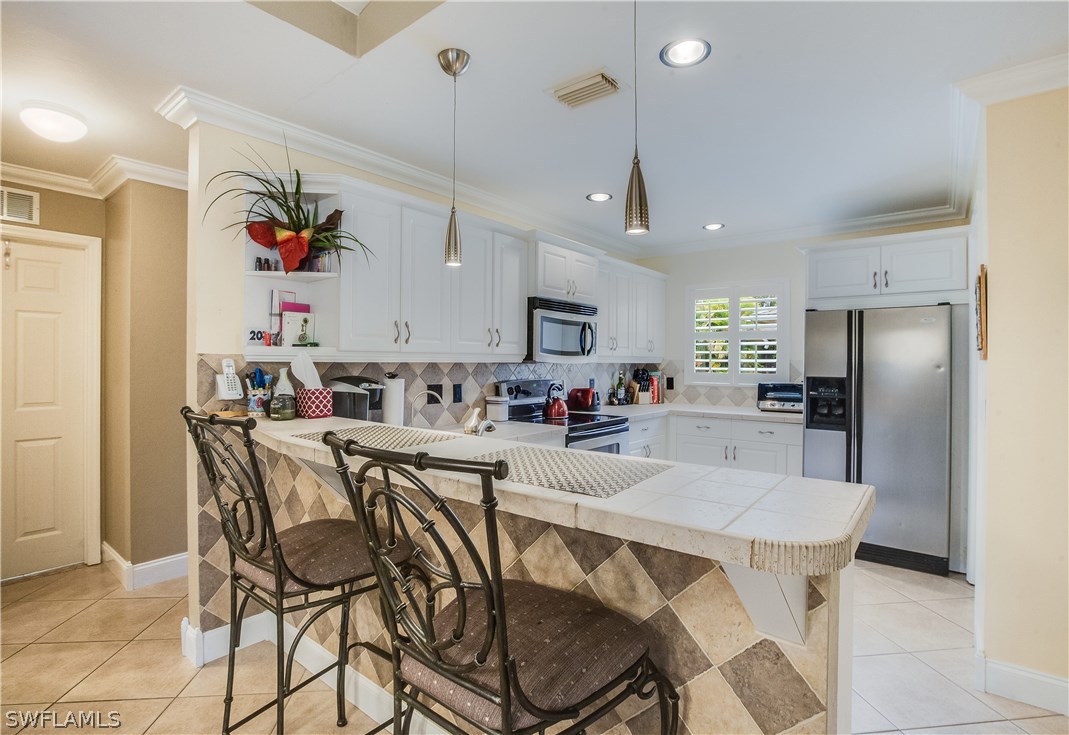 17373 Butler Road Fort Myers, FL 33967 - Photo 8 of 20 a view of a dining area with furniture