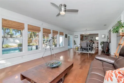 a bathroom with a granite countertop toilet sink and mirror