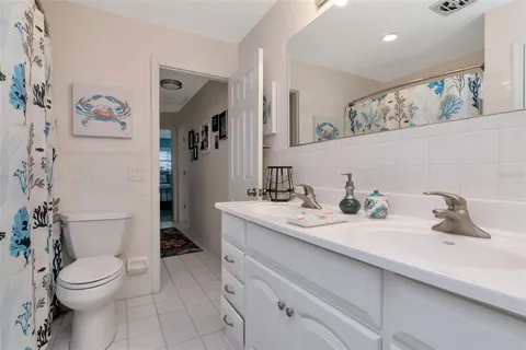 a spacious bedroom with a bed and a table