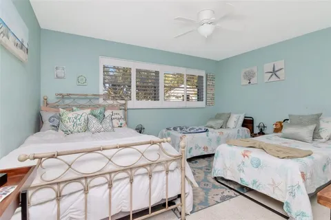 a view of swimming pool with a table and chairs