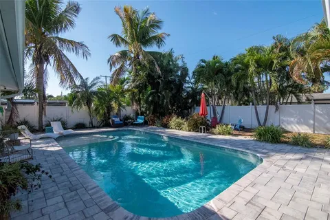 a backyard of a house with outdoor seating