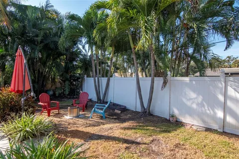 a view of a backyard with plants and a patio