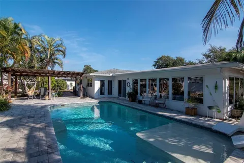a view of a chairs and table in patio
