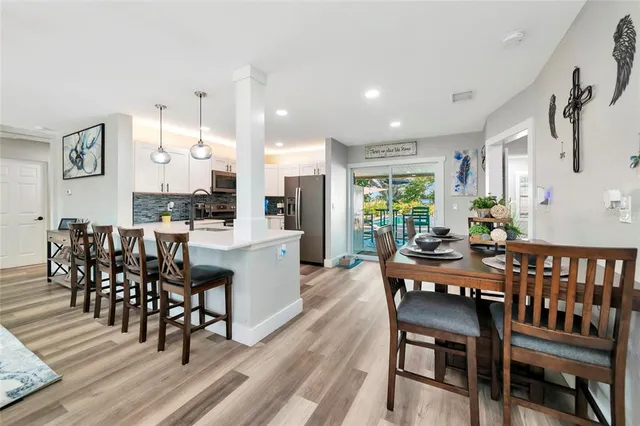 a bedroom with a bed closet and flat tv screen