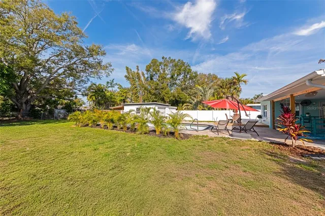 a view of swimming pool from a yard