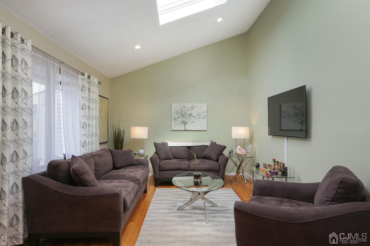 103 Westminster Road Colonia, NJ 07067 - Photo 5 of 26 a living room with furniture and a couch