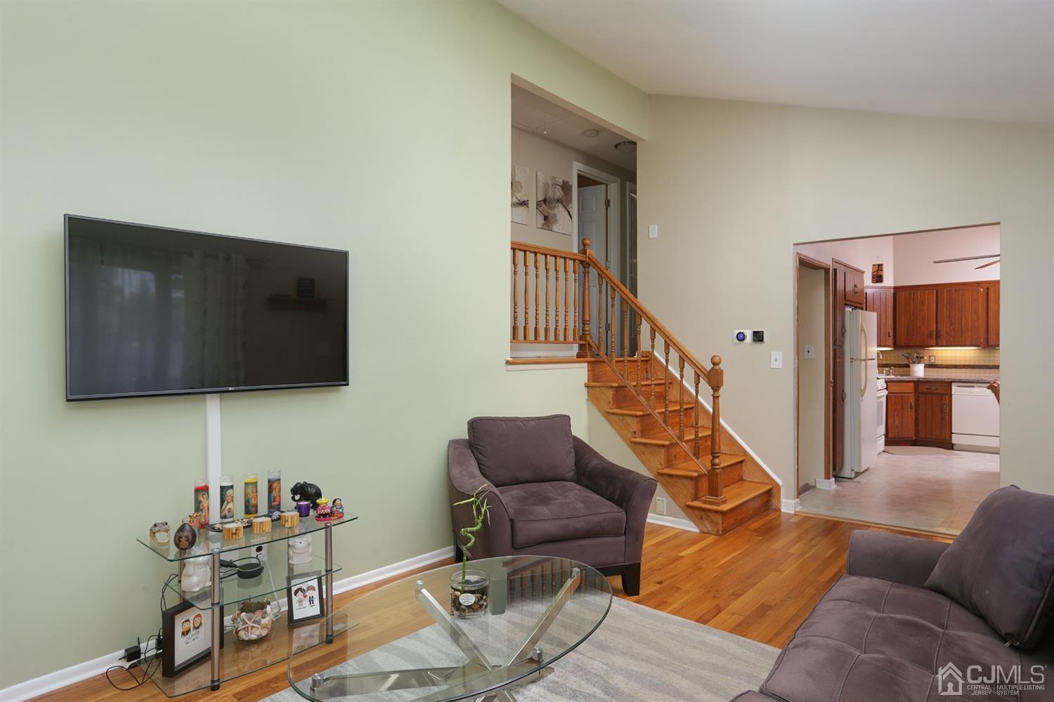 103 Westminster Road Colonia, NJ 07067 - Photo 7 of 26 a living room with furniture and a flat screen tv