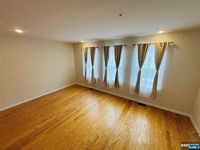 a view of wooden floor and chair in a room