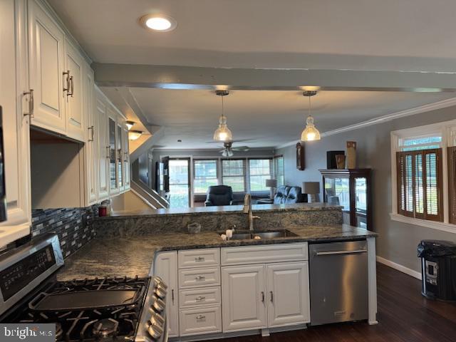 1355 Forrest Street Trainer, PA 19061 - Photo 14 of 37 a kitchen with stainless steel appliances granite countertop a stove and a sink