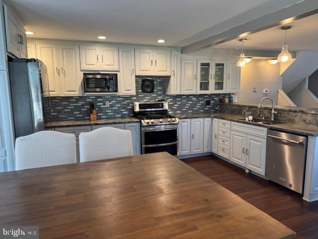 1355 Forrest Street Trainer, PA 19061 - Photo 20 of 37 a kitchen with stainless steel appliances granite countertop a stove a sink and a refrigerator