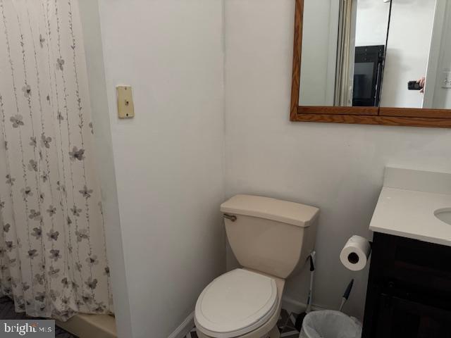 1355 Forrest Street Trainer, PA 19061 - Photo 28 of 37 a white toilet sitting next to a bathroom sink