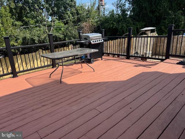 1355 Forrest Street Trainer, PA 19061 - Photo 9 of 37 a view of a roof deck with wooden floor and fence