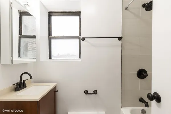 a bathroom with a sink and mirror