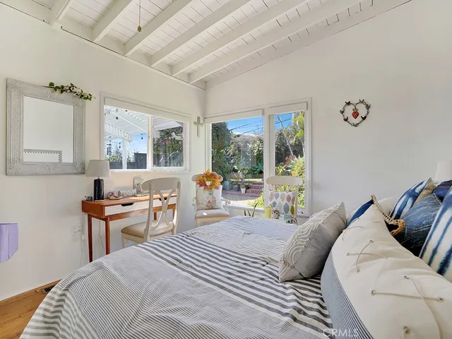 a bed room with a bed and a chair