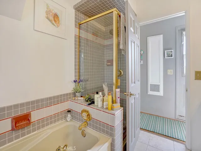 a bathroom with a tub and sink