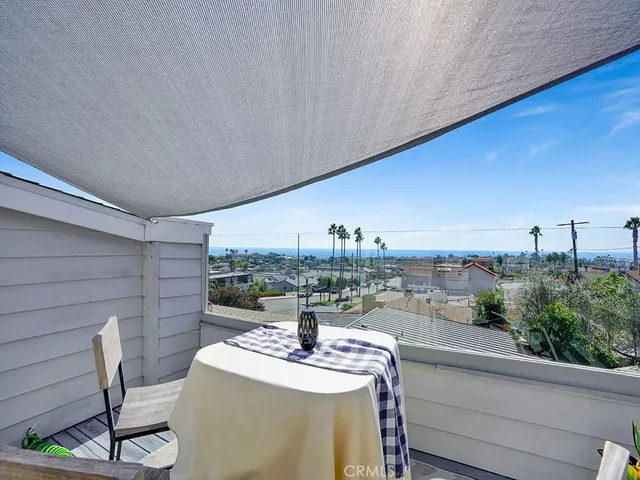 a terrace with a table and chairs