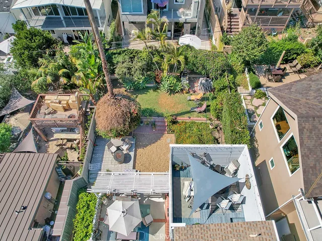 an aerial view of a house with outdoor space