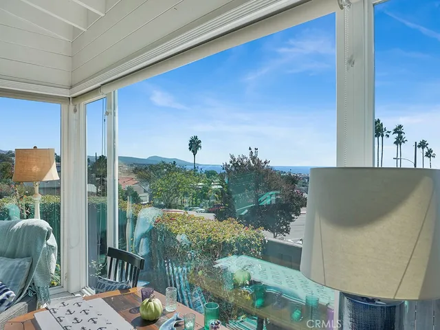 a balcony with a table and chairs