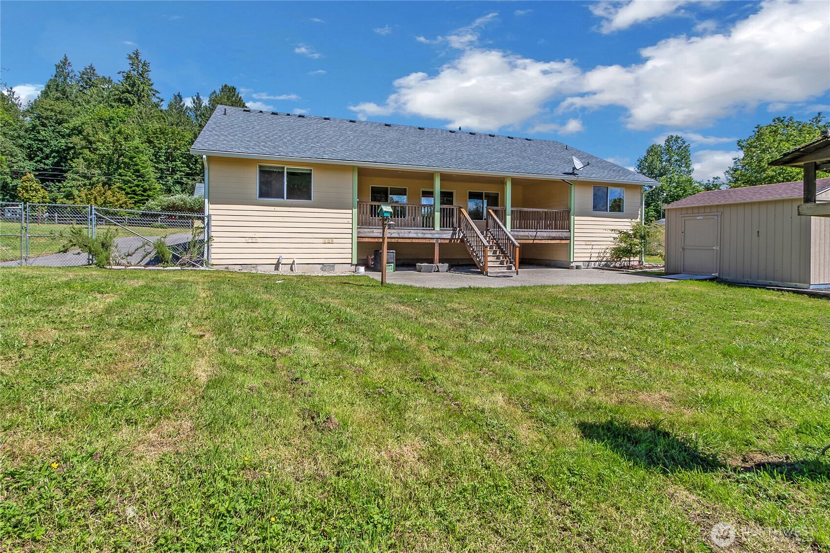 1450 Southeast Spruce Road Port Orchard, WA 98367 - Photo 33 of 39 a view of a house with backyard porch and sitting area