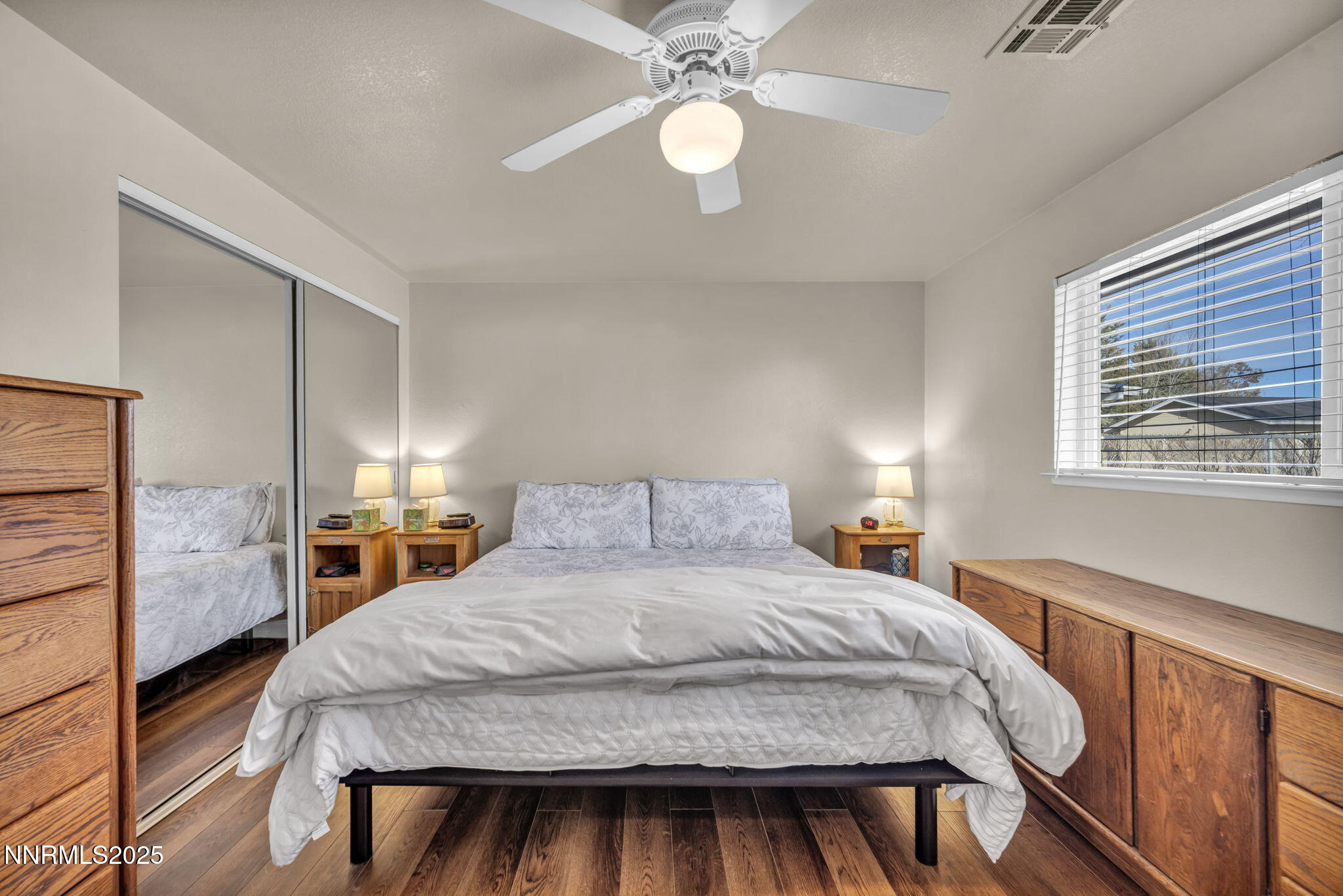 707 Addler Road Gardnerville, NV 89460 - Photo 42 of 72 a bedroom with a bed and a chandelier