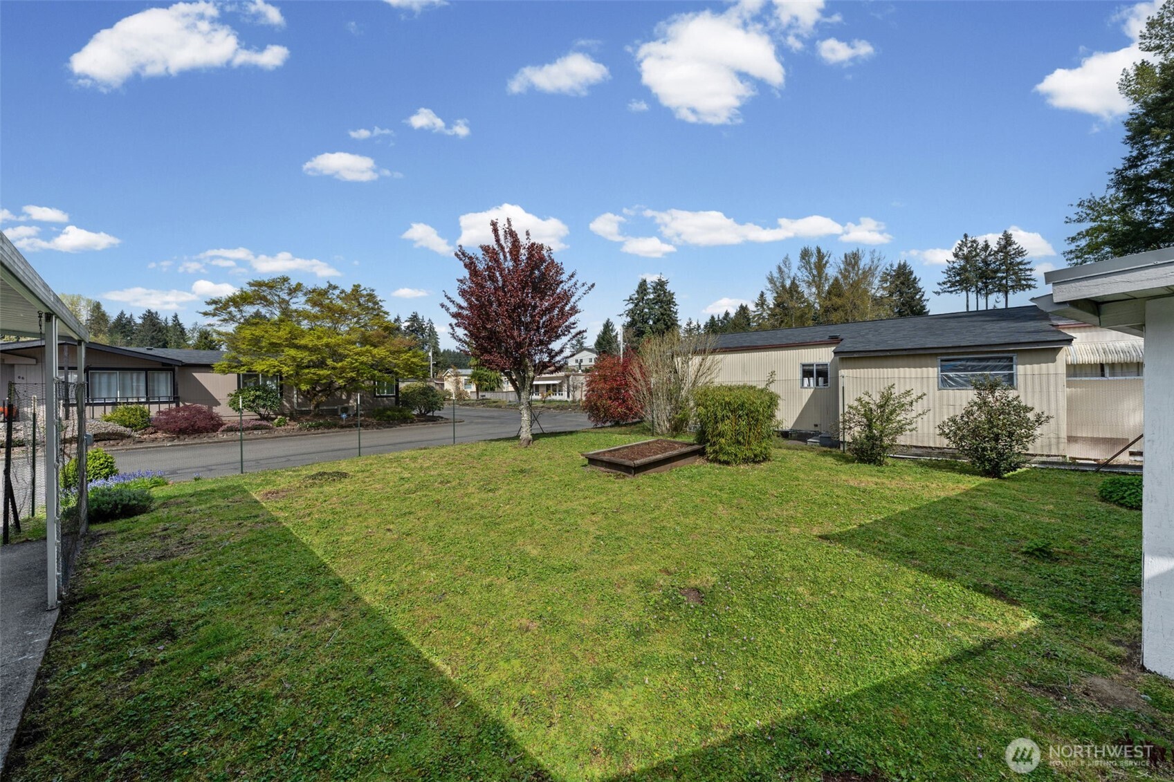 930 Trosper Road Southwest, Unit 33 Tumwater, WA 98512 - Photo 21 of 26 a view of a backyard with a garden