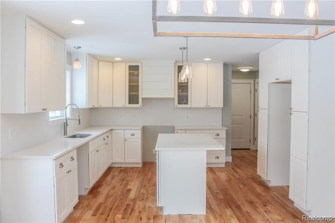 98 North Baldwin Road Oxford, MI 48371 - Photo 6 of 33 Shaker Cabinets, Subway Tile and Shiplap Range Hood