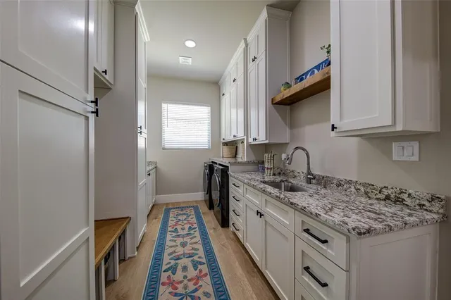 a bed sitting in a bedroom next to a large window